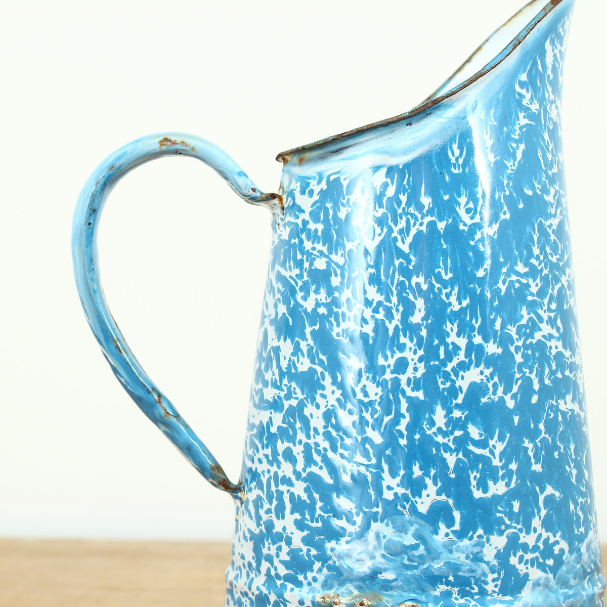 A vintage French blue and white marbled pattern enamel pitcher jug, 24cm high